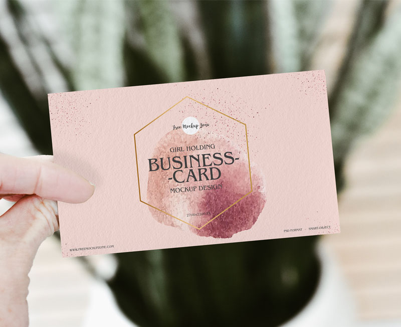 Free Girl Holding PSD Business Card Mockup