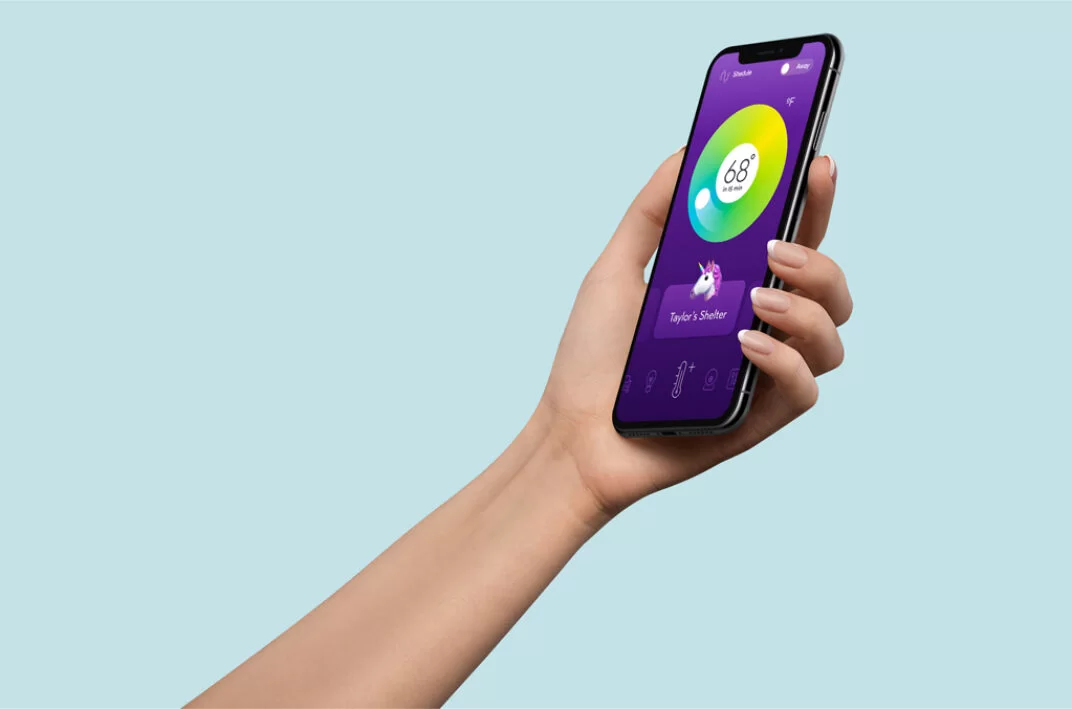 Hand holding iPhone XS Free PSD Mockup