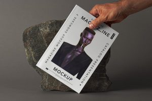 Hand Holding Magazine Free PSD Mockup
