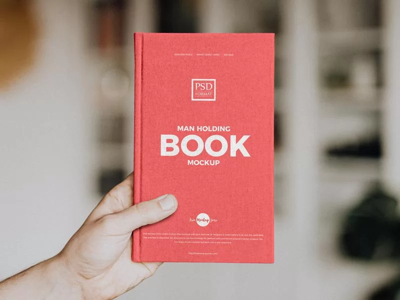 Man Holding Book Free (PSD) Mockup