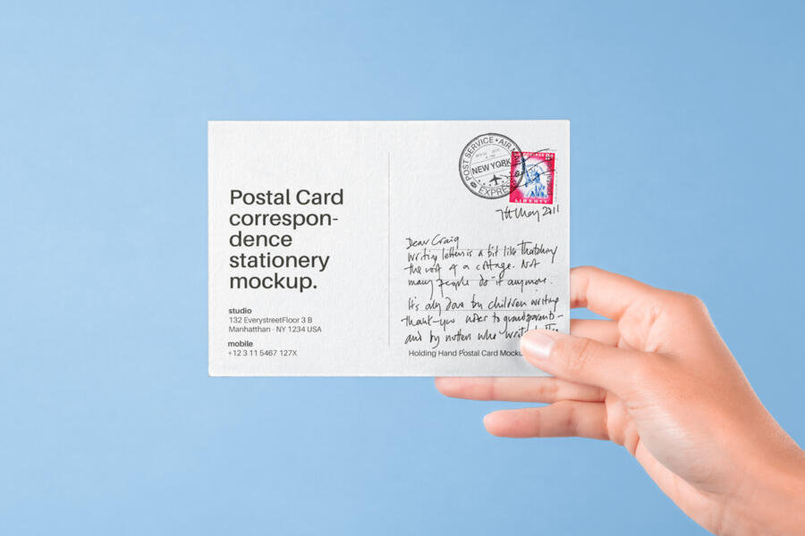 Hand Holding Postal Card Free Mockup